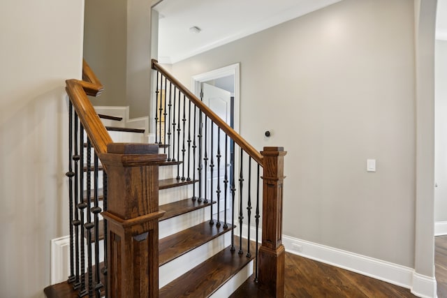 stairway with wood-type flooring