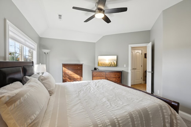 bedroom with ceiling fan and vaulted ceiling