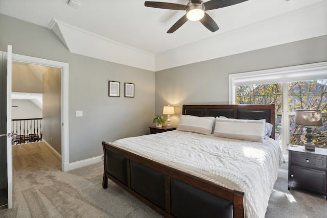 carpeted bedroom with ceiling fan and lofted ceiling