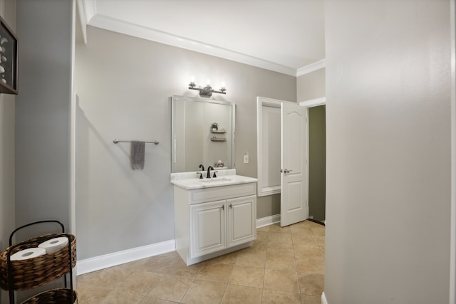 bathroom with tile patterned floors, vanity, and ornamental molding