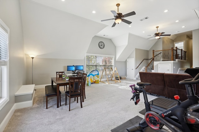 interior space featuring ceiling fan, light colored carpet, and vaulted ceiling