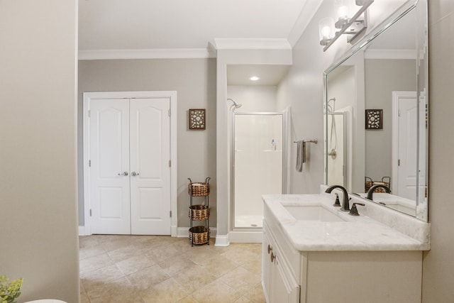 bathroom with vanity, a shower with shower door, and ornamental molding