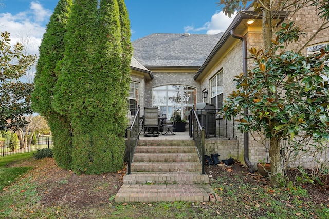 entrance to property featuring a patio