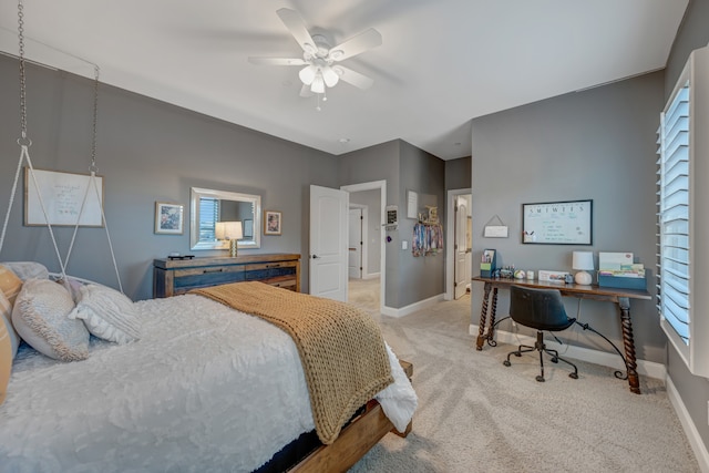 bedroom featuring light carpet and ceiling fan