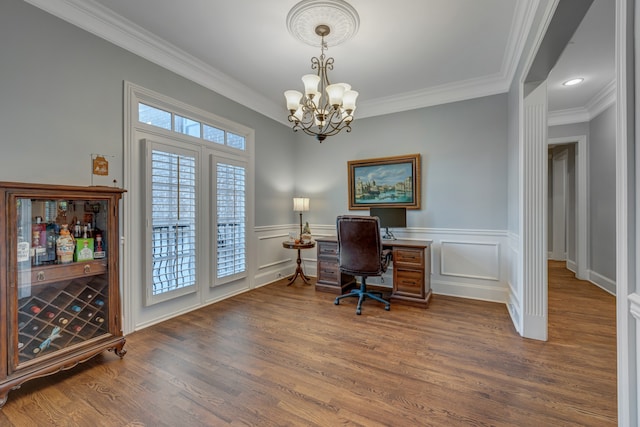 office space with a chandelier, dark hardwood / wood-style floors, and ornamental molding