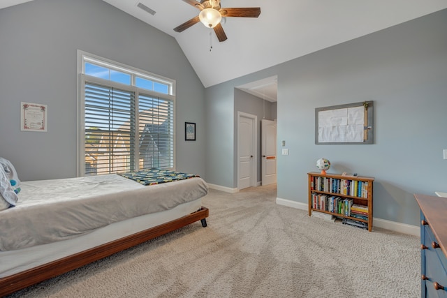 carpeted bedroom with ceiling fan and vaulted ceiling