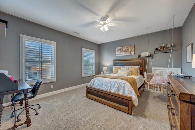 bedroom with ceiling fan and light colored carpet