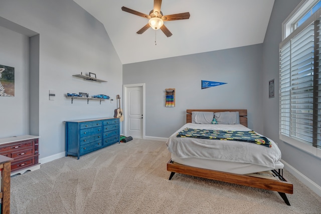 carpeted bedroom featuring ceiling fan and high vaulted ceiling