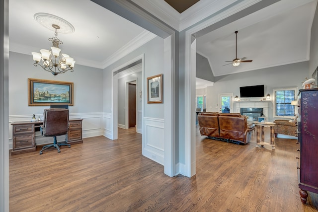 office area featuring lofted ceiling, wood-type flooring, ceiling fan with notable chandelier, and ornamental molding