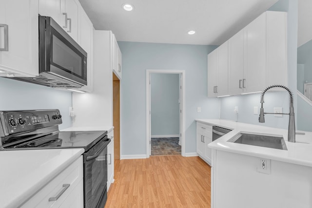 kitchen with white cabinets and stainless steel appliances