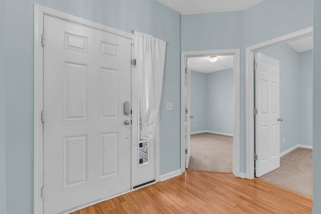 foyer entrance featuring light wood-type flooring