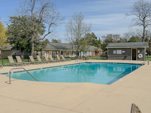 view of pool with an outdoor structure and a patio