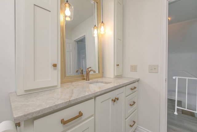 bathroom with vanity and wood-type flooring