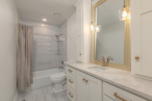 full bathroom featuring shower / bath combo, vanity, and toilet