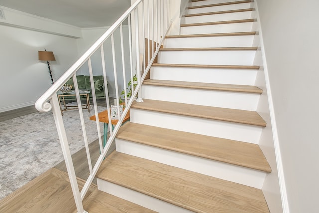 staircase featuring hardwood / wood-style floors