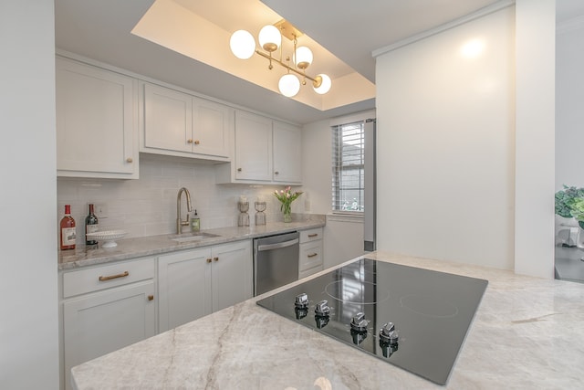 kitchen with dishwasher, black electric cooktop, white cabinets, and sink