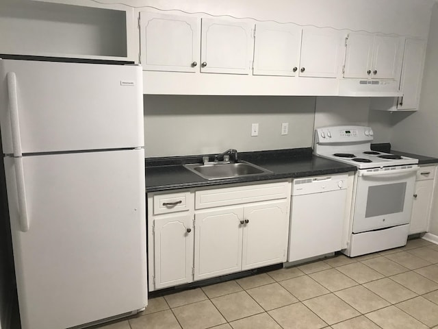 kitchen with white cabinets, white appliances, light tile patterned flooring, and sink