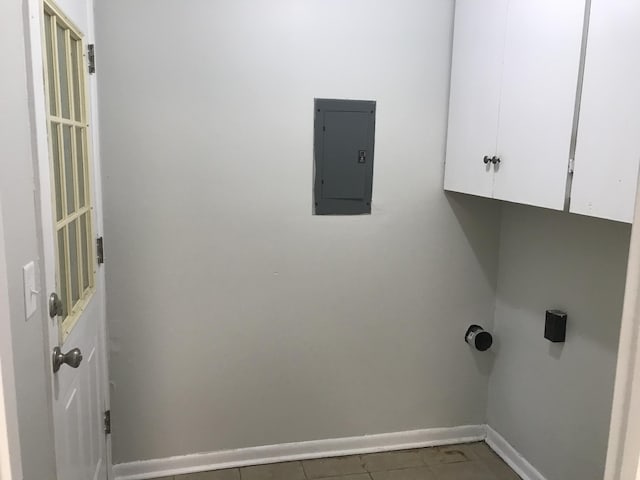 laundry room with cabinets and electric panel