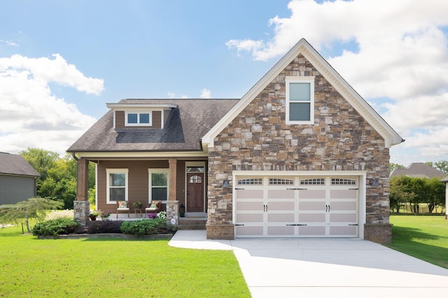 view of front of property featuring covered porch, a front yard, and a garage