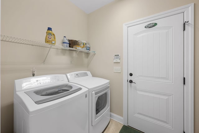 clothes washing area with independent washer and dryer