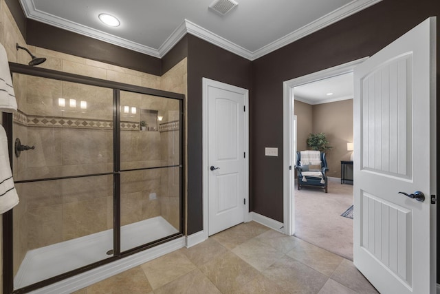 bathroom featuring tile patterned flooring, walk in shower, and ornamental molding