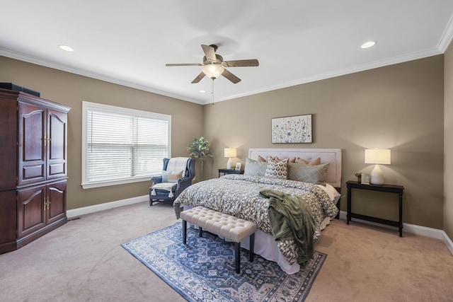 carpeted bedroom with ceiling fan and crown molding