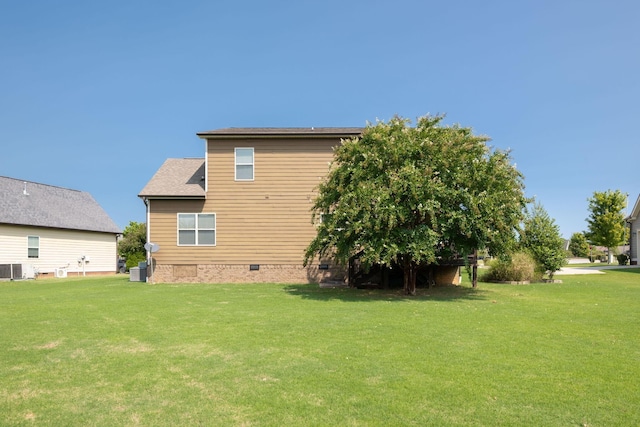 back of property with a lawn