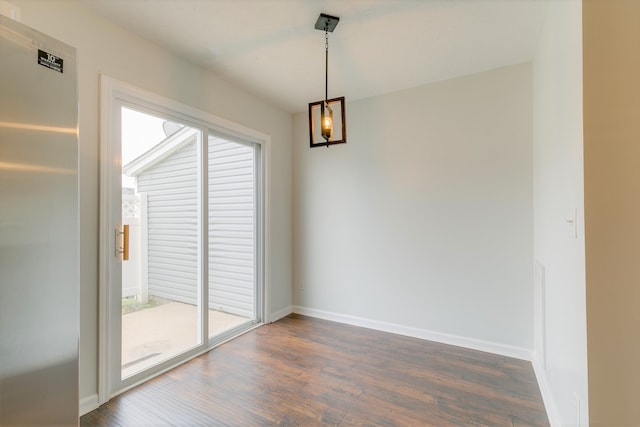 unfurnished dining area with dark hardwood / wood-style flooring