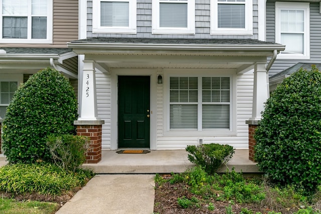 3425 Harpeth Springs Dr, Nashville, TN 37221 - property entrance featuring a porch and roof with shingles