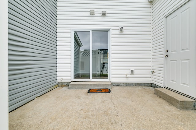 doorway to property with a patio