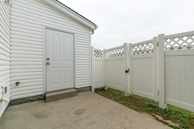 property entrance with a patio area