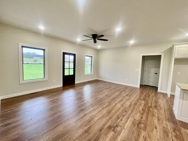 interior space featuring hardwood / wood-style floors and ceiling fan