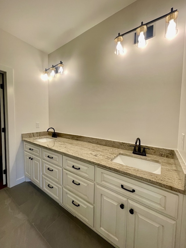 bathroom with tile patterned floors and vanity