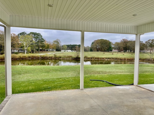 view of patio featuring a water view