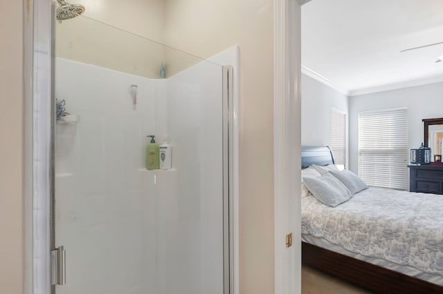 bathroom featuring an enclosed shower, crown molding, and ceiling fan