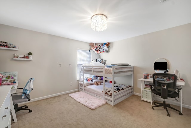 bedroom featuring a chandelier and light colored carpet