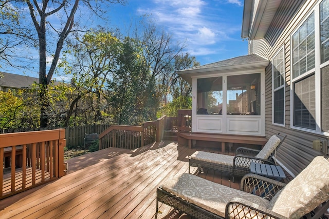 wooden terrace featuring a sunroom