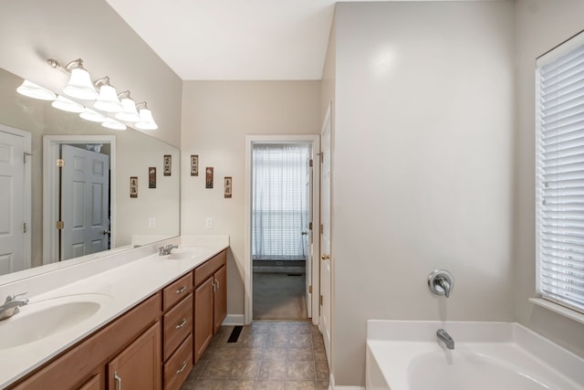 bathroom with a bathtub and vanity