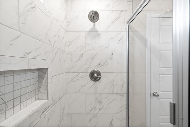 bathroom featuring tiled shower