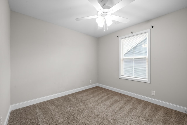 unfurnished room featuring plenty of natural light, ceiling fan, and carpet floors