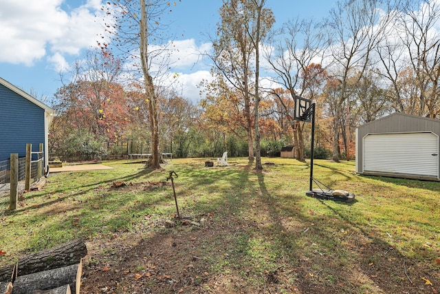 view of yard featuring an outbuilding and a garage