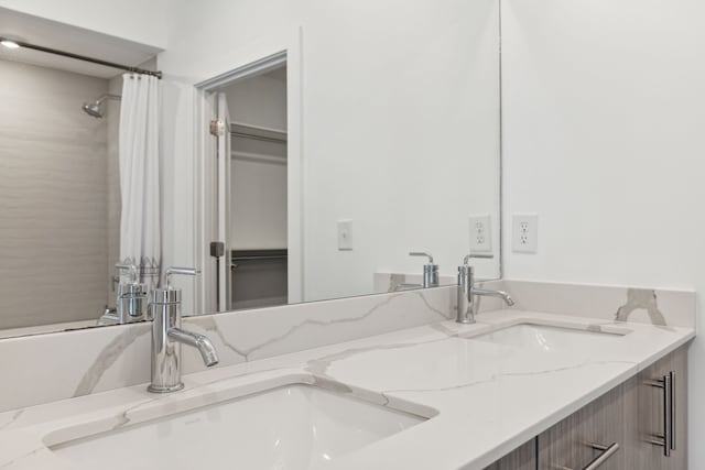 bathroom with vanity and curtained shower