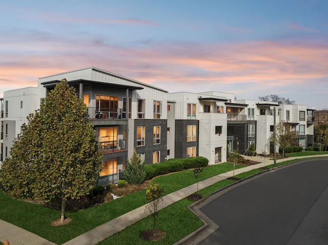 view of outdoor building at dusk