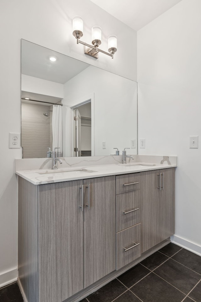 bathroom with tile patterned flooring and vanity