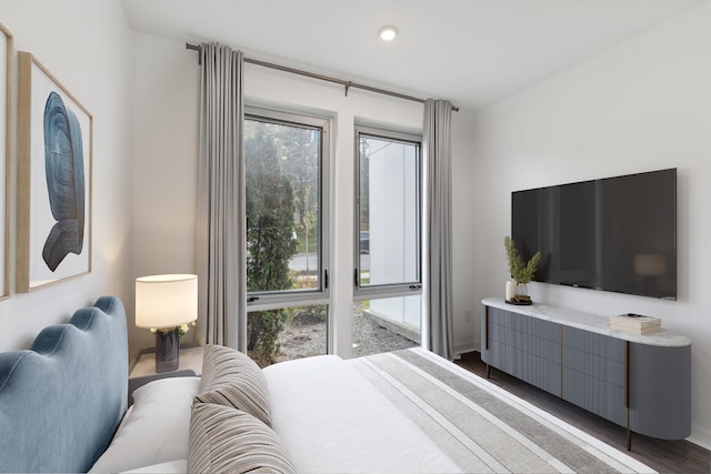 bedroom featuring dark hardwood / wood-style flooring