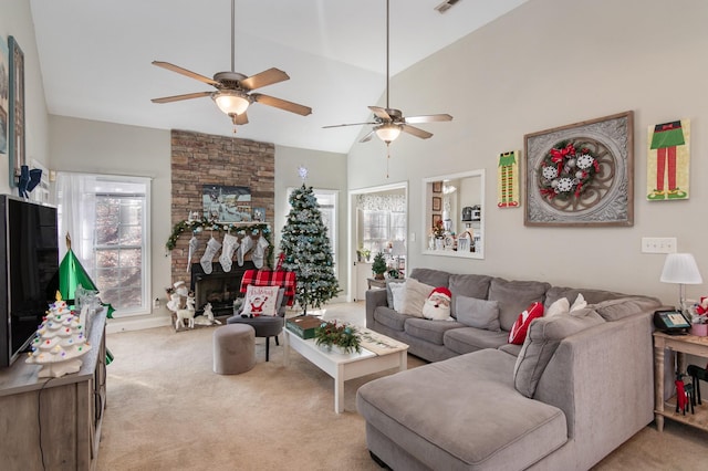 living room featuring a fireplace, light colored carpet, ceiling fan, and lofted ceiling