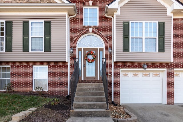 doorway to property featuring a garage