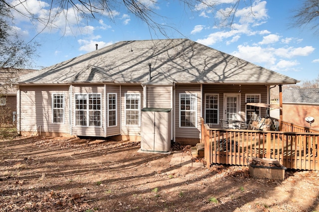 back of house with a deck