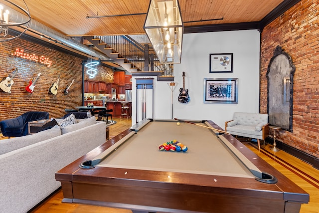 recreation room with wood ceiling, brick wall, and light wood-type flooring