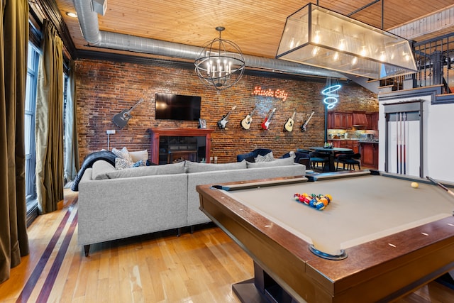 recreation room with light wood-type flooring, billiards, wood ceiling, and brick wall